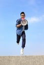 Man jump and shout megaphone Royalty Free Stock Photo