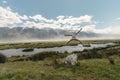 Man jumping with amazing landscape background of mountain and lake view. Glenorchy, New Zealand Royalty Free Stock Photo