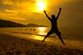 Man jumping on beach sunset