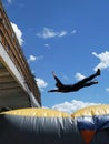 Man jumping down to the Inflatable Rescue Cushion also known as a Jump Cushion - rescuing people Royalty Free Stock Photo