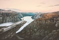 Man jumping on the edge of Trolltunga cliff Royalty Free Stock Photo