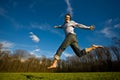 Man jumping in a field Royalty Free Stock Photo