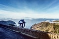 Man jumping high up on a mountain hike. Royalty Free Stock Photo