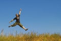 Man jumping on a meadow Royalty Free Stock Photo