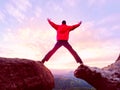 Man jumping from the mountain edge. Man jumping off a cliff without rope. Risky moment. Royalty Free Stock Photo