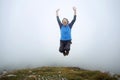 Man jumping on mountain peak Royalty Free Stock Photo