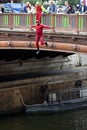 A man jumping off a bridge