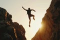 Man Jumping off Cliff Into Air Royalty Free Stock Photo
