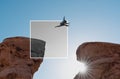 A man jumping out of monochrome frame crossing cliff. Positive thinking and out of the box concept Royalty Free Stock Photo