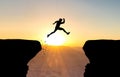 Man jumping over abyss. Royalty Free Stock Photo