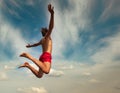 Man jumping over cloudly sky background. Summer fun lifestyle Royalty Free Stock Photo