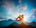 Man jumping over rocks in parkour action in mountains.