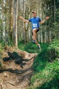 Man jumping participating in trail race Royalty Free Stock Photo