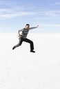 Man jumping at the salt lake in Bolivia