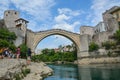 Man jumping from a very high ancient bridge in Mostar Royalty Free Stock Photo