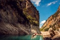 Man jumping into the water of a gorge in the Pyrenees mountains Royalty Free Stock Photo