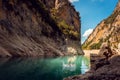 Man jumping into the water of a gorge in the Pyrenees mountains Royalty Free Stock Photo