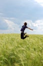 Man jumping in wheat field