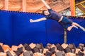 The man jumps into the foam pit