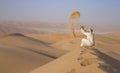 Man in kandura in a desert at sunrise Royalty Free Stock Photo