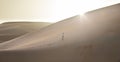 Man in kandura in a desert at sunrise Royalty Free Stock Photo