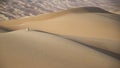 Man in kandura in a desert at sunrise Royalty Free Stock Photo