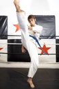 Man, karate and high kick for martial arts in ring, self defense or jiujitsu training for fighting match. Male person