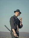 Man with katana sword and sunglasses standing on blue sky Royalty Free Stock Photo