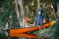 Man with a kayak in the forest wilderness Royalty Free Stock Photo