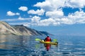 The man in a kayak on Lake Baikal Royalty Free Stock Photo