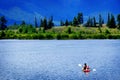 Man on Kayak on Lake Mountains Wilderness Paddling Royalty Free Stock Photo