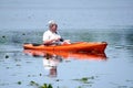 Retired man floating in a kayak Royalty Free Stock Photo