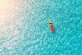 Man on a kayak in the sea with clear turquoise water. Kayaking, leisure activities on the ocean