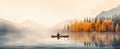 a man kayaking in an autumn colored lake Royalty Free Stock Photo