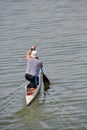 A man is kayaking on the lake on a summer day. Sports and outdoor activities, lifestyle