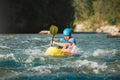 Man kayaking over the mountain river rapids Royalty Free Stock Photo