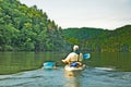 Man Kayaking on Quiet Lake