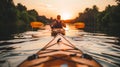 Man kayaking at sunset on calm sea, rear view of paddler in kayak enjoying peaceful waters Royalty Free Stock Photo