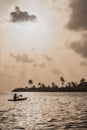 Man kayaking during sunset in a calm sea Royalty Free Stock Photo