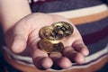 Man is keeping bitcoin cryptocurency gold coin in his hand Royalty Free Stock Photo