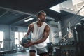 Man On Kettlebell Workout. Sexy Asian Sportsman With Strong, Healthy, Muscular Body Using Heavy Fitness Equipment. Royalty Free Stock Photo