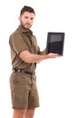 Man in khaki uniform presenting a shockproof digital tablet. Royalty Free Stock Photo