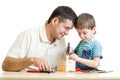 Man and kid child boy tinkering nesting box Royalty Free Stock Photo