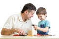 Man and kid child boy tinkering nesting box Royalty Free Stock Photo