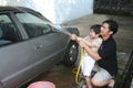 Man & kid washing car