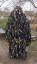 Man in a kikimora camouflage net. Russian-Ukrainian war