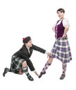 Man in kilt teaching woman Scottish dance