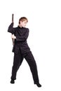 Man in a kimono practicing kung fu with nunchaku