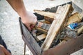 A man kindles a fire in a brazier with matches Royalty Free Stock Photo