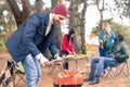 Man kindling fire on grill